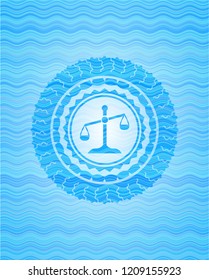 scale icon inside water emblem background.
