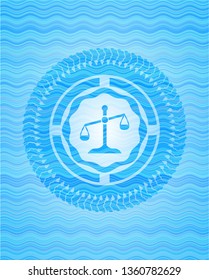 scale icon inside water representation badge.