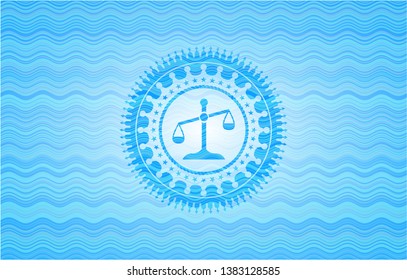 scale icon inside water wave style emblem.