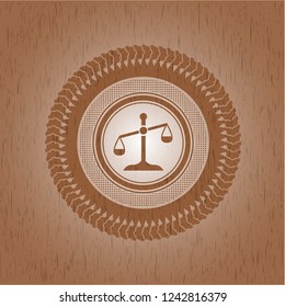 scale icon inside wooden emblem. Retro