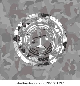 scale icon on grey camouflage pattern