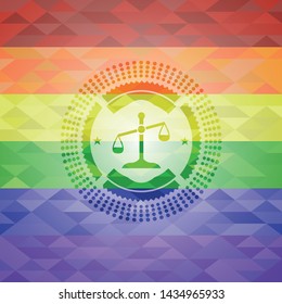 scale icon on mosaic background with the colors of the LGBT flag