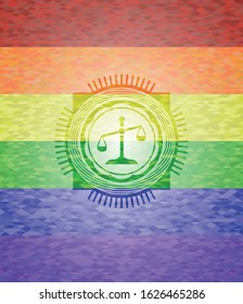 scale icon on mosaic background with the colors of the LGBT flag