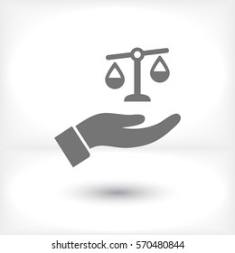scales in his hand icon