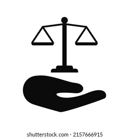 Scales of justice in hand silhouette icon, legal law vector cut silhouette for social media.