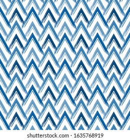 Scales seamless pattern. Repeated chevrons motif. Hand drawn doodle traditional oriental asian ornament. Classic geometric surface print. Freehand brush design texture. Vector abstract background
