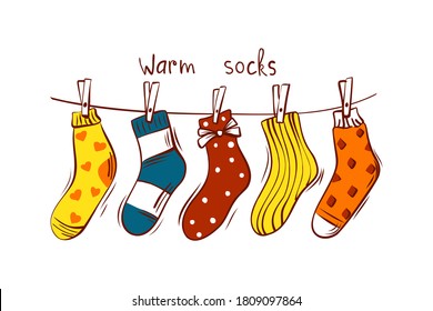 Scandinavian interior - hanging gift socks on an isolated background. Cozy winter holiday season. Cute in the style of Hygge. Vector.