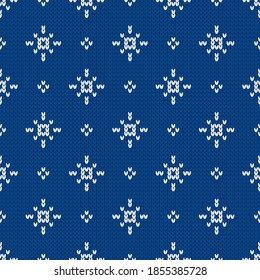 Scandinavian knitted seamless pattern. Norwegian native style sweater with snowflakes. Wool texture. Winter holiday background. Vector illustration.