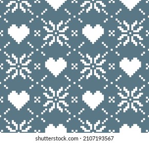 Scandinavian knitting seamless pattern design. Nordic star with heart pattern in white and blue.