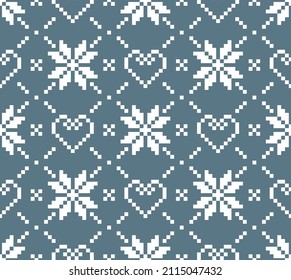 Scandinavian knitting seamless pattern design. Nordic star and heart pattern in white and blue.