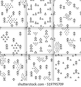 Scandinavian pattern with fir trees and triangles. Seamless winter patterns, hand drawn in black ink. Perfect for gift wrapping or printing on fabric. Christmas pattern for festive decoration