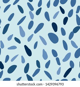 Scandinavian pebble seamless pattern on blue background. Random stones backdrop. Abstract geometric dotted wallpaper. Vector illustration