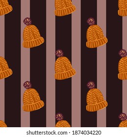 Scandinavian seamless doodle pattern with orange knitted hat elements. Striped dark background. Flat vector print for textile, fabric, giftwrap, wallpapers. Endless illustration.