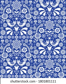 Scandinavian seamless folk art vector pattern, floral repetitive background with birds and flowers in white on navy blue. Decorative floral ethnic wallpaper, monochrome retro textile design