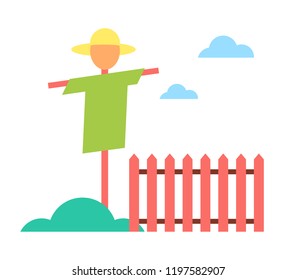 Scarecrow in garden on farm cartoon vector icon. Schematic picture of straw dummy in hat and clothes among plants, bogey standing near fence isolated