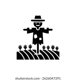 Scarecrow Standing Tall in the Middle of a Crop Field Dressed in Old Clothes