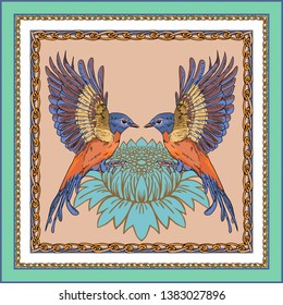 A scarf with the image of two birds on the background of a flower. Orange birds are sitting on a blue flower.