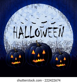 Scary Halloween background. Pumpkin lanterns with glowing eyes in the dark cemetery against huge moon and many bats.