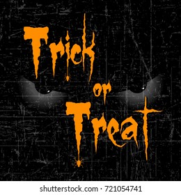 Scary Halloween Eyes with Creative text of Trick or Treat on dark scary grungy retro background.
