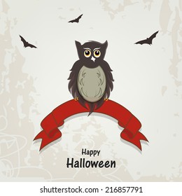 Scary owl sitting on red ribbon with flying bats on grungy grey background for Happy Halloween celebration. Poster, banner or flyer design. 