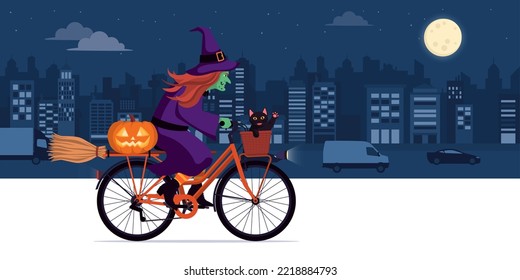 Scary Ugly Witch Riding A Bicycle At Night In The City Street: She Is Carrying A Black Cat, A Broom And A Halloween Pumpkin