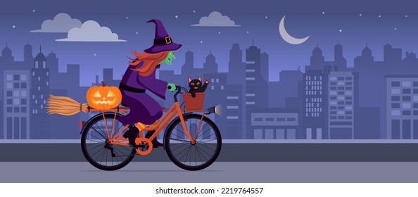 Scary ugly witch riding a bicycle at night in the city street: she is carrying a black cat, a broom and a Halloween pumpkin