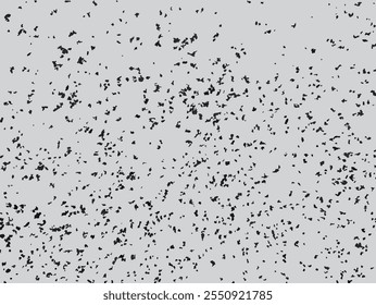 Scattered ash particle vector illustration. Monochrome grunge texture with random black specks on gray background. Mottled pattern with random spots