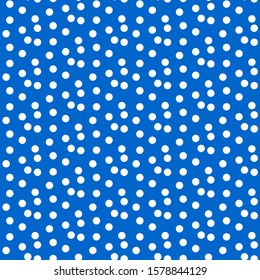 Scattered dots blue polka background seamless pattern. Vector illustration.