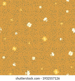 Scattered flowes seamless vector pattern on a spotted ochre yellow background. Surface print design for fabrics, stationery, scrapbook paper, gift wrap, textiles, and packaging.