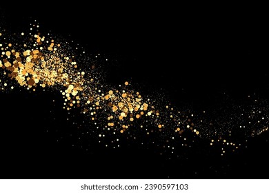 Scattered golden particles on a dark background. Festive background or design element.