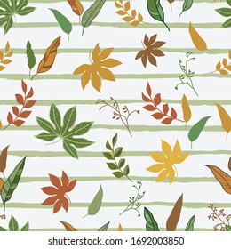 Scattered leaves on the striped background seamless pattern