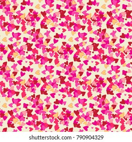 Scattered little hearts seamless pattern in pink and red over beige. Valentine's day background. Romantic vector illustration.