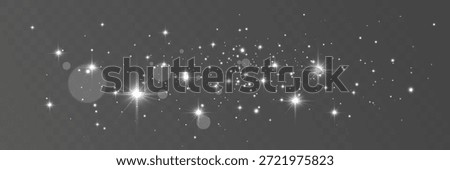 Scattered sparkling light particles with lens flares on transparent background.