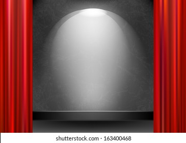 Scene illuminated by a spotlight and open the red curtain
