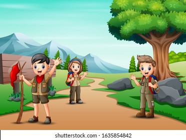 Scene with many kids in scout uniform hiking in the park