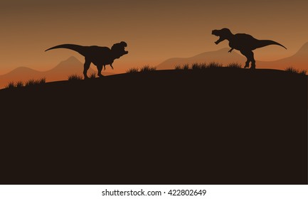 Scenery tyrannosaurus of silhouette in tthe fields