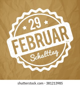 Schalttag 29 Februar Stempel German white on a crumpled paper brown background.