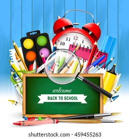 School background with school supplies and green chalkboard