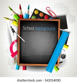School blackboard with school supplies and copyspace 