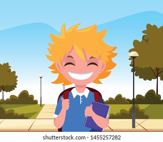 school boy with bag in the park
