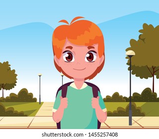 school boy with bag in the park