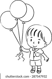 school boy holding balloons