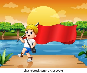 Un escolar sostiene una bandera roja en el muelle