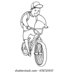 School boy riding bmx bycicle