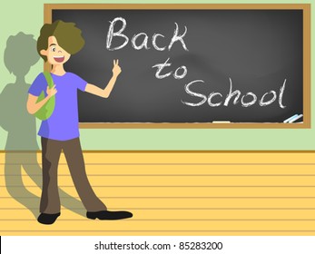 school boy with the sign of back to school on blackboard