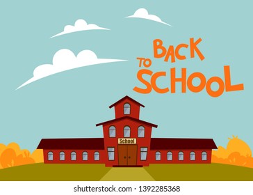 school building against the background of yellow autumn foliage and the inscription back to school against the blue sky