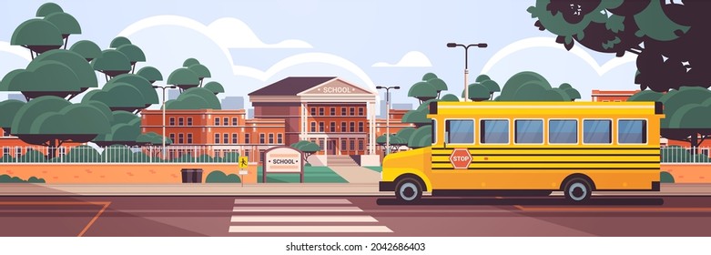 school building empty front yard with green trees road crosswalk and school bus