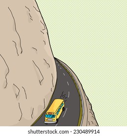 School bus driving on bend in road on mountain