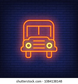 School bus neon sign. Modern orange school bus with headlights. Night bright advertisement. Vector illustration in neon style for transportation and education