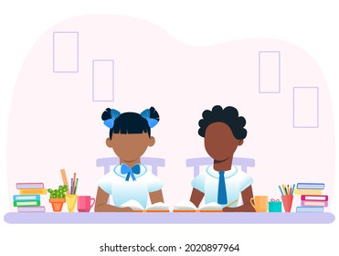 School and education. African American and European children sit at a desk with a textbook. Back to school for textbooks and theoretical, practical assignments.